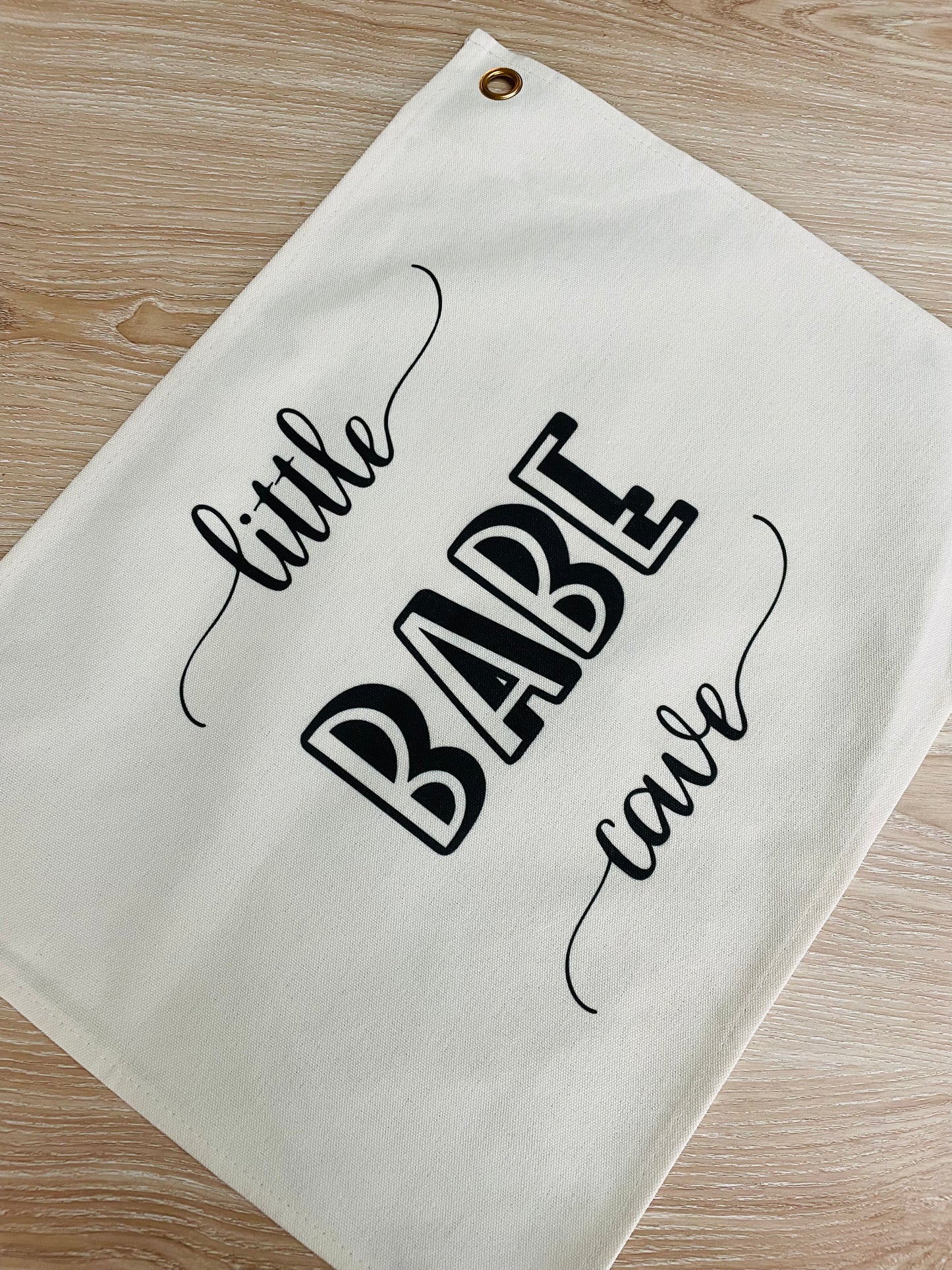wall flag with little babe cave written on it