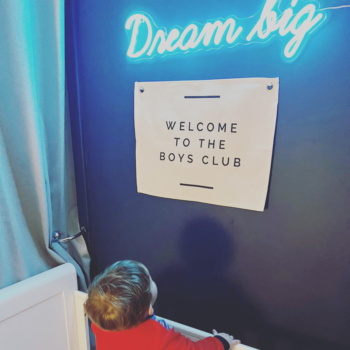 wall flag with welcome to the boys club on it
